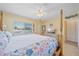 Relaxing main bedroom featuring a large bed, dresser, and ample natural light, creating a cozy retreat at 475 Benjamin Franklin Dr # 211, Sarasota, FL 34236