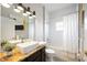 Bright bathroom with a shower and bath, stylish tile, and modern fixtures at 5091 Creekside Trl, Sarasota, FL 34243
