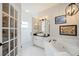 This bathroom boasts a shower and soaking tub with modern fixtures at 5091 Creekside Trl, Sarasota, FL 34243