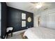 Bright and modern bedroom with a large window and stylish decor at 5091 Creekside Trl, Sarasota, FL 34243