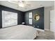 Bright and modern bedroom with a large window and stylish decor at 5091 Creekside Trl, Sarasota, FL 34243