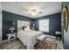 Well-lit bedroom with an area rug, and a large window at 5091 Creekside Trl, Sarasota, FL 34243