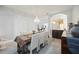 Dining area with natural light showcases chandelier and is seamlessly connected to the kitchen at 5091 Creekside Trl, Sarasota, FL 34243