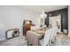 Elegant dining room with a chandelier, a large table set for a meal, and stylish décor at 5091 Creekside Trl, Sarasota, FL 34243
