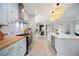 Modern kitchen features stainless steel appliances, ample counter space, and eye-catching geometric backsplash at 5091 Creekside Trl, Sarasota, FL 34243