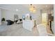 Spacious kitchen with island, modern appliances, and an open design flowing into the living area, perfect for entertaining at 5091 Creekside Trl, Sarasota, FL 34243