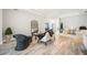 Serene living space showcasing neutral tones, comfortable seating, and ample natural light for a relaxing atmosphere at 5091 Creekside Trl, Sarasota, FL 34243