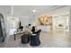 Bright, open-concept living room with modern furnishings and an island overlooking the kitchen and breakfast nook at 5091 Creekside Trl, Sarasota, FL 34243