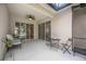 Enjoy the outdoors from the screened patio featuring a ceiling fan and lake views for perfect relaxation at 5091 Creekside Trl, Sarasota, FL 34243