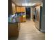 Kitchen featuring wood cabinets, stainless steel appliances, modern flooring, and ample counter space at 5094 Bunyan St, Sarasota, FL 34232