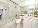 Clean bathroom with tiled shower, glass door, and modern vanity at 5669 Midnight Pass Rd # 308, Sarasota, FL 34242