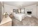Cozy bedroom with a queen size bed, plush carpet, and plenty of natural light at 5669 Midnight Pass Rd # 308, Sarasota, FL 34242