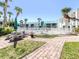 A community space offers a picnic table and lush landscaping to compliment pool at 5669 Midnight Pass Rd # 308, Sarasota, FL 34242