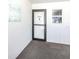 Condo front entry door with decorative welcome art is perfect for a beach vacation at 5669 Midnight Pass Rd # 308, Sarasota, FL 34242