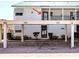 Beautiful condo exterior features covered parking, well-maintained landscaping, and a welcoming entrance at 5669 Midnight Pass Rd # 308, Sarasota, FL 34242