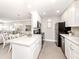 Well-lit kitchen with stainless appliances, adjacent to the dining and living area at 5669 Midnight Pass Rd # 308, Sarasota, FL 34242