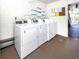 On-site laundry room with multiple washing machines for easy access at 5669 Midnight Pass Rd # 308, Sarasota, FL 34242