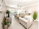Bright living room featuring tile floors, neutral walls, and a sliding glass door to a private balcony at 5669 Midnight Pass Rd # 308, Sarasota, FL 34242