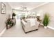 Cozy living room with neutral décor, comfortable seating, and sliding doors to balcony at 5669 Midnight Pass Rd # 308, Sarasota, FL 34242