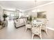 Open-concept living and dining area with neutral tones and a relaxing ambiance at 5669 Midnight Pass Rd # 308, Sarasota, FL 34242