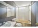 Bathroom featuring a shower-tub combo with white tiled walls and a vanity with a sink and mirror at 5829 Coventry Dr, Tampa, FL 33615
