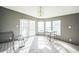 Bright dining area with natural light, a small table, and access to the outdoors through glass doors at 5829 Coventry Dr, Tampa, FL 33615