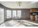 Bright dining area featuring natural light, neutral walls, and carpeted floors at 5829 Coventry Dr, Tampa, FL 33615