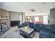 Comfortable living room showcasing a fireplace, an open floor plan, and neutral décor at 5829 Coventry Dr, Tampa, FL 33615