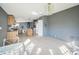 Open-concept living space with wood cabinets, an island, and natural light at 5829 Coventry Dr, Tampa, FL 33615