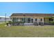 Manicured backyard with a view of the enclosed back patio at 602 Park Cir, Bradenton, FL 34207
