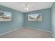 This bedroom has two windows bringing in the outside sunlight and neutral-colored carpet at 602 Park Cir, Bradenton, FL 34207