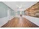 Bright living room with hardwood floors and an open layout connecting to the kitchen at 602 Park Cir, Bradenton, FL 34207