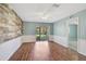 Spacious living room with hardwood floors and sliding glass doors leading to the backyard at 602 Park Cir, Bradenton, FL 34207