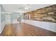 Bright living room with hardwood floors and an open layout connecting to the kitchen at 602 Park Cir, Bradenton, FL 34207