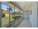A view from the sunroom looking out into the landscaped backyard at 602 Park Cir, Bradenton, FL 34207