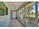 Sunroom featuring tile flooring and multiple windows at 602 Park Cir, Bradenton, FL 34207