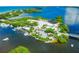 An aerial view of a marina near the ocean, offering docking services and boat access at 6248 Donnington Ct, Sarasota, FL 34238