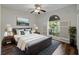 Bedroom featuring an arched window providing lots of natural light at 6248 Donnington Ct, Sarasota, FL 34238