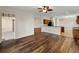 Open concept living space with hardwood floors and a ceiling fan at 6248 Donnington Ct, Sarasota, FL 34238