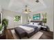 Bright main bedroom with large windows and hardwood floors at 6248 Donnington Ct, Sarasota, FL 34238