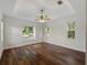Spacious main bedroom with hardwood floors and abundant natural light at 6248 Donnington Ct, Sarasota, FL 34238