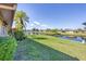 Beautiful backyard with waterfront views, mature landscaping, and room for outdoor activities at 6422 Auburn Ave, Bradenton, FL 34207