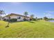 Scenic backyard with waterfront views and lush lawn offering a serene retreat at 6422 Auburn Ave, Bradenton, FL 34207