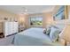 Inviting bedroom boasting serene water views, soft carpet, and a double bed at 6422 Auburn Ave, Bradenton, FL 34207
