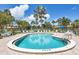 Inviting community pool with clear, refreshing water and comfortable lounge chairs for a relaxing experience at 6422 Auburn Ave, Bradenton, FL 34207