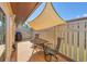 Cozy patio area with round table and chairs, with shade provided by an awning at 6422 Auburn Ave, Bradenton, FL 34207