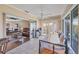 Bright sunroom features tile flooring, ceiling fan, and sliding glass doors to outdoor area and living area at 6422 Auburn Ave, Bradenton, FL 34207