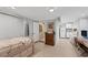 Cozy basement bedroom with adjacent kitchenette and dining area, perfect for guests or a home office at 7320 Melaleuca Way, Siesta Key, FL 34242