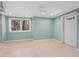 Bright basement living space features neutral walls, recessed lighting, and access to outside views at 7320 Melaleuca Way, Siesta Key, FL 34242