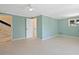 Versatile basement area with neutral paint, tile flooring, interior doors, and potential for a home theater at 7320 Melaleuca Way, Siesta Key, FL 34242